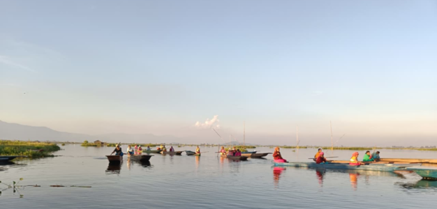 fisherfolk rowing their boats